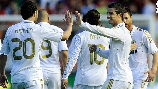 Cristiano Ronaldo and Gonzalo Higuain both scored twice in Real Madrid's 5-1 rout of Osasuna on Saturday