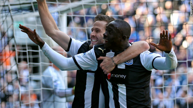 Papiss Cisse celebrates scoring twice for Newcastle in their 2-0 win over 10-man Liverpool.