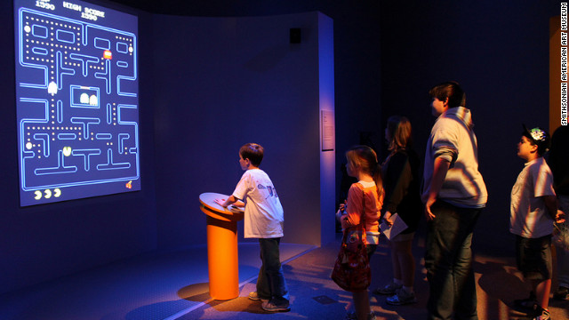 Kids line up to play a video game that was created before they were born. "Pac-Man" is one of five playable games in the exhibit -- "Super Mario Brothers," "Myst," "Flower" and "The Secret of Monkey Island" are the others.