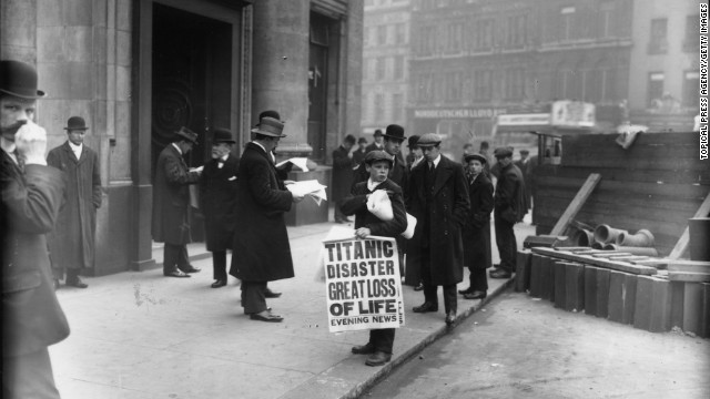 Newspaper boy Ned Parfett sells copies of the Evening News on April 16, 1912 outside the White Star Line offices in London.