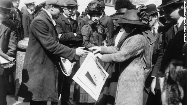 A woman buys a souvenir print of the Titanic shortly after the disaster.