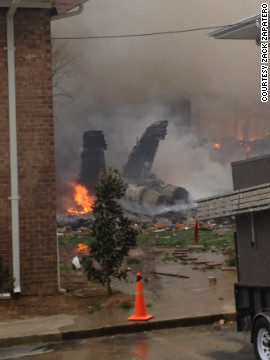 A Navy jet crashed Friday into apartments near Virginia Beach, Virginia, sending flames and thick black smoke into the air, a military spokesman and a witness said. At least two people were hurt, a hospital spokeswoman said.