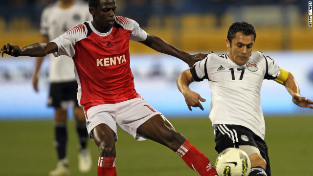 Hassan challenges Kenya's Raphael Mungai Kiongera during a friendly football match in Doha, Qatar, on February 27. It was his 179th appearance for Egypt, making him the most-capped international footballer in history.