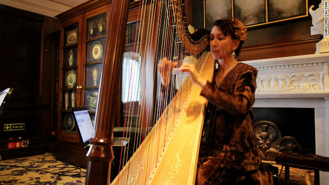 Mary Amanda Fairchild plays the harp aboard the Azamara Journey.