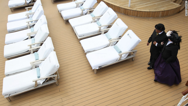 Laurie and Dan Castaneda of Long Beach, California, walk on the deck of the Azamara Journey in period clothing. 