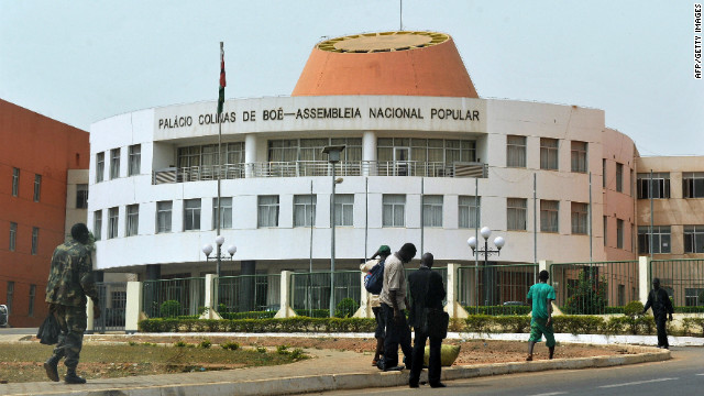 Residents walk past the Parliament in Bissau, capital of Guinea-Bissau. African countries rank as at high risk in the index, partly due to their natural susceptibility to events such as floods, droughts, fires, storms or landslides. But their high ranking is also a product of the vulnerability of the population and the inadequacies of existing infrastructure to adapt to or tackle climate change challenges because of weak economies, governance, education and health care.