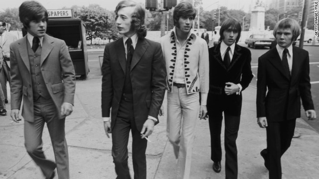 The Bee Gees walk down a New York City Street in 1968. From left to right, bassist Vince Melouney, Robin Gibb, Barry Gibb, Maurice Gibb, and drummer Colin Peterson.