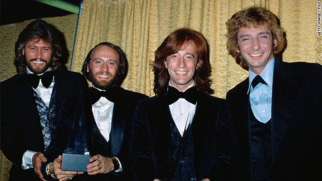 The Bee Gees pose with Barry Manilow at the American Music Awards in1979. Manilow won the award for Favorite Pop/Rock Male Artist, and the Bee Gees won Favorite Pop/Rock Band, Duo, or Group.
