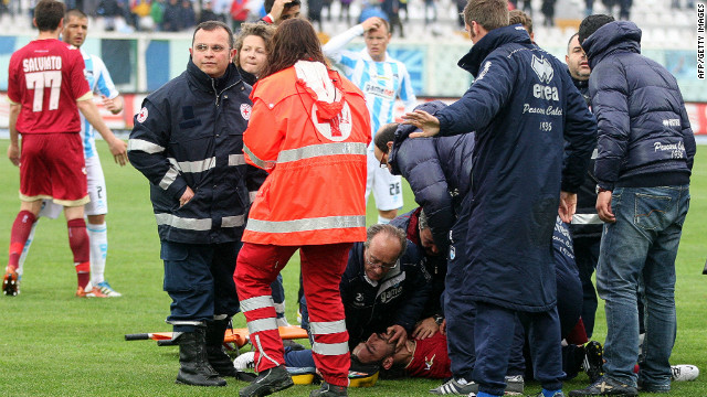 Medics treat Morosini on the pitch in Pescara after he suffered a heart-attack during the Serie B match. 