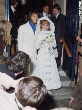 Maurice Gibb and his new bride, Scottish pop singer Lulu, exit Gerrards Cross Church in Buckinghamshire, England, on February 18, 1969.