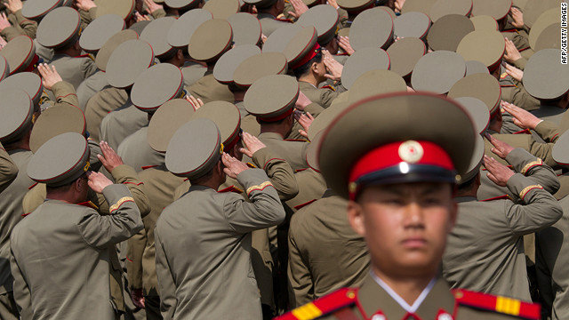 North Korean soldiers salute during a military parade to mark 100 years since the birth of the country's founder Kim Il-Sung on April 15.