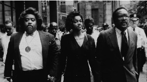 Tawana Brawley holds hands with Sharpton and her attorney outside the New York Supreme Court in 1990. 