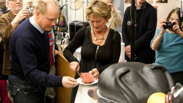 Swedish culture minister Lena Adelsohn Liljeroth cuts the controversial cake.