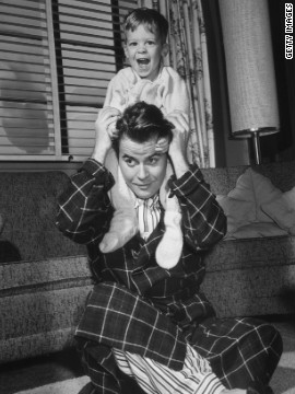 American TV personality Dick Clark plays with his son, circa 1955. Clark died Wednesday at age 82.