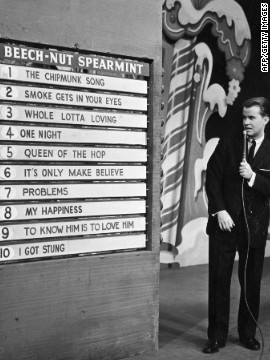 Clark announces the week&squot;s top 10 popular songs during an episode of the TV show, "American Bandstand," circa 1958. 