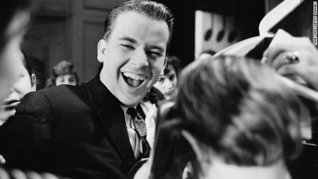 Clark laughes with teenagers on "Amercian Bandstand" circa 1958.