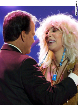 Clark and Cher hug during the taping of the 50th anniversary speical of "American Bandstand."