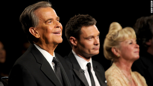 Clark, Ryan Seacrest and Kari Clark attend the Emmy Awards in 2010.