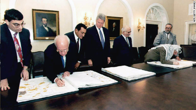 Mubarak, third from left, joins President Bill Clinton, Israeli Prime Minister Yitzhak Rabin, second from left, Jordan's King Hussein, third from right, and Palestinian leader Yasser Arafat, second from right, in Washington in 1995. The Israeli leader and Arafat signed maps representing the redeployment of Israeli troops in the West Bank.