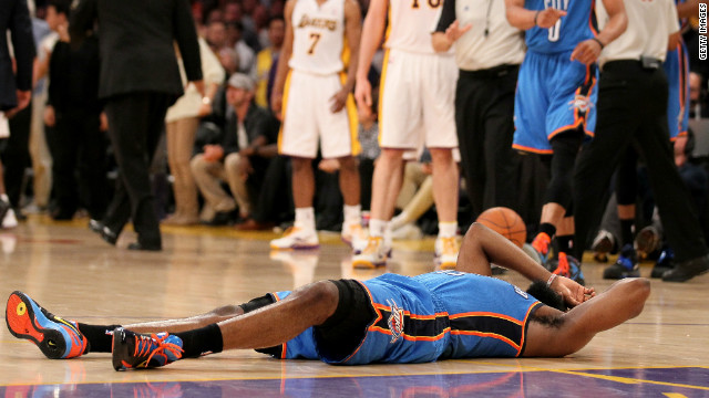 James Harden of the Oklahoma City Thunder lies on the court after being hit by Metta World Peace on Sunday.