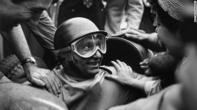 Fangio is mobbed by fans after winning the 1955 Italian Grand Prix. The racing legend had 24 wins and five world championships in a career spanning almost 20 years.<br/><br/>