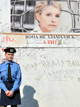 A police guard stands outside Tymoshenko's cell at the Kachanivska prison in Kharkiv. Her supporters have called on president Victor Yanukovych to quit in the wake of allegations of abuse.