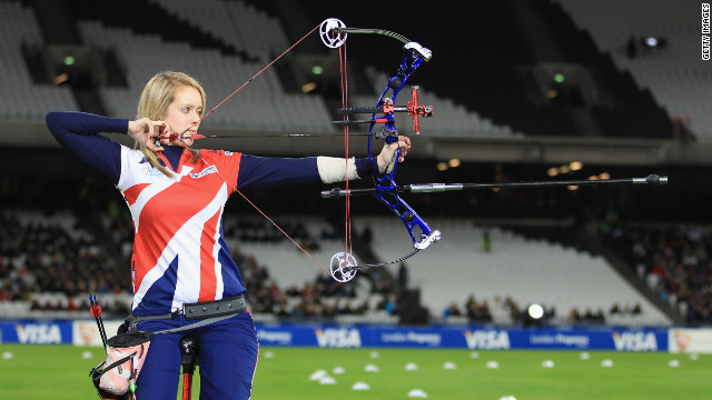 Brown fired arrows into a spinning target, covered with the names of 100 children in the crowd -- and Clarke-Willis was the lucky winner. <br/><br/>