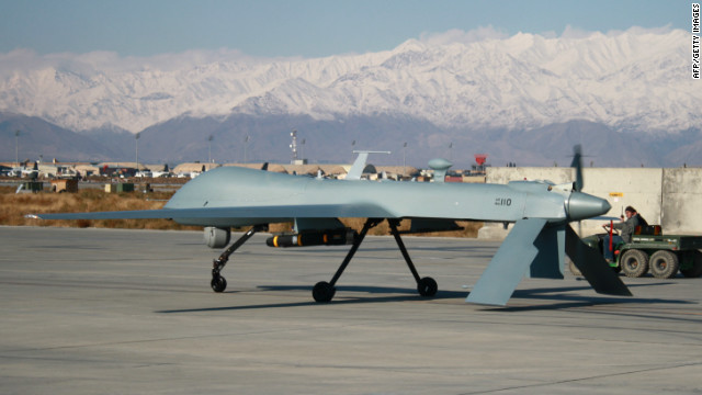 A U.S. Predator unmanned drone armed with a missile sets off from its hangar at Bagram Air Base on November 27, 2009.