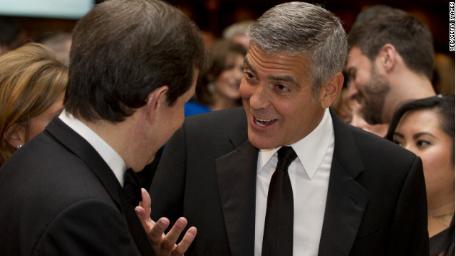 George Clooney, right, talks with Chris Wallace on April 28. Clooney's fundraiser for Obama raised $15 million in one night.