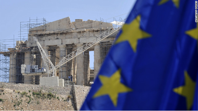 An EU flag is flies in front of the ancient Acropolis in Athens on May 9, 2012. 