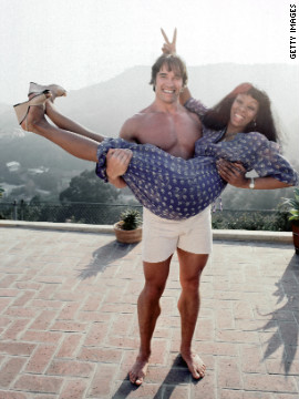 Summer gets a lift from future movie star and politician Arnold Schwarzenegger at her home in Los Angeles in April 1977.