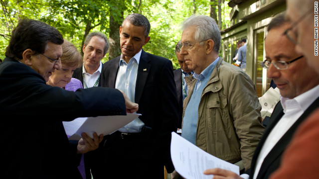  Obama and other members of the G* Summit review documents at Camp David.