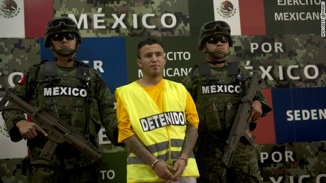 Mexican soldiers escort suspect Daniel de Jesus Elizondo Ramirez, known as 