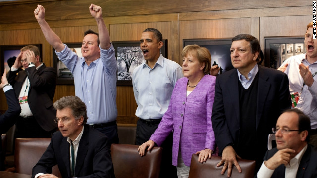 U.S. President Barack Obama watched the action at a G8 summit at Camp David, with British Prime Minister David Cameron to his right and German Chancellor Angela Merkel on his left.