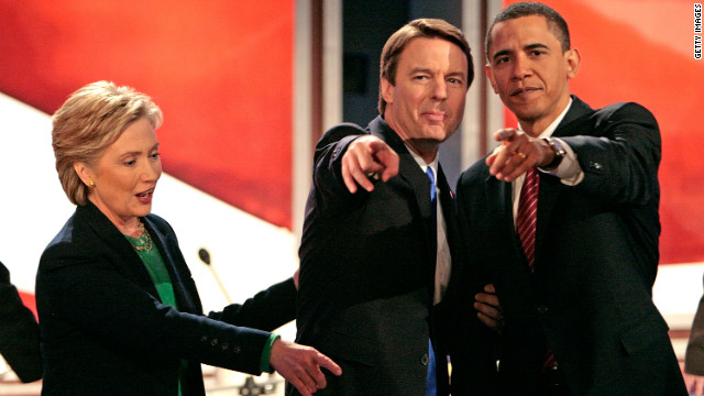 Presidential hopefuls Hillary Clinton, Edwards and Barack Obama point to supporters and family members in the audience after a debate in New Hampshire in January 2008.