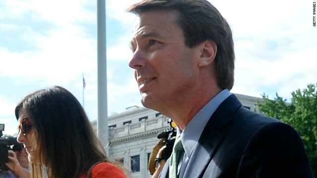 Edwards enters a Greensboro, North Carolina, courthouse for his federal corruption trial with daughter Cate on May 21, 2012. 