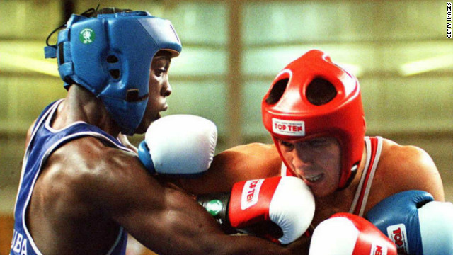 Hector Vinent Charon trains the youngsters at the Rafael Trejo boxing gym in Havana. Charon (left) is a two-time Olympic gold medalist, having won the light welterweight at both the 1992 and 1996 Games.