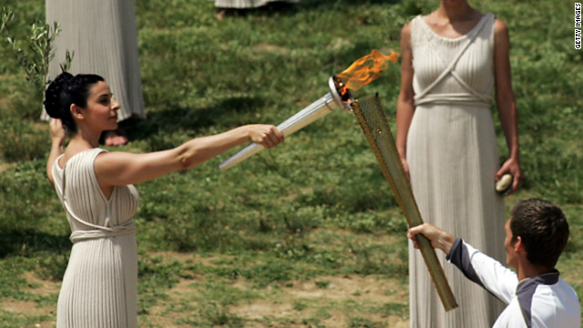 Amid the tumbledown columns and olive groves of the ancient stadium in Olympia, Greece, the 2012 flame is lit. Actor Ino Menegaki played the high priestess in the traditional ceremony on May 10.