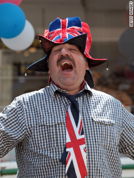 A Porlock resident gets into the Olympic spirit as the torch passes through his town on day three of the relay. Crowds have turned out in their hundreds to cheer on the flame as it makes its 8,000-mile journey across the UK. 