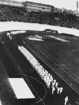 The Olympic flame originated in ancient Greece, where a fire was kept burning throughout the Games. The tradition was reintroduced at the 1928 Amsterdam Olympics, pictured here during the opening ceremony.