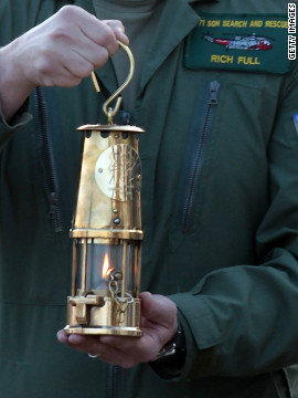 Lieutenant Commander Richie Full delivers the Olympic flame at Land's End. Just two days later, on May 21, the torch went out as para-badmington star David Follett carried it through Devon. It was relit using a back-up flame with Games chiefs admitting it was not uncommon for the torch to go out.