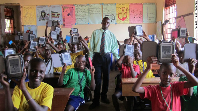 Students and their teacher at Humble School in Mukono, Uganda. E-readers are considered an effective approach to encouraging literacy in parts of the developing world where traditional books are scarce, because they give students direct access to a greater number of titles.