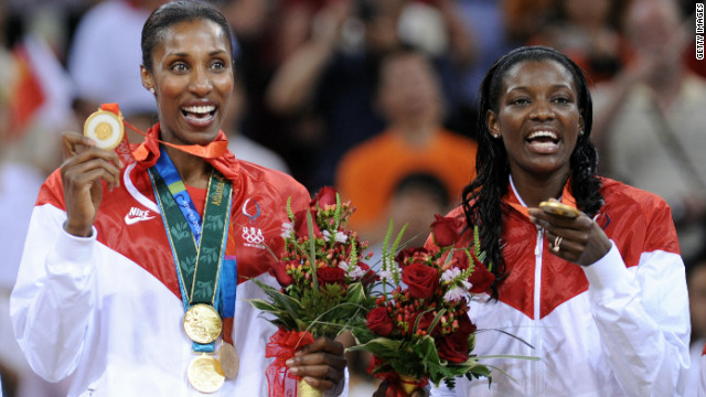 Lisa Leslie, left, proudly displays the four gold medals she won after collecting the last at the 2008 Beijing Olympics.