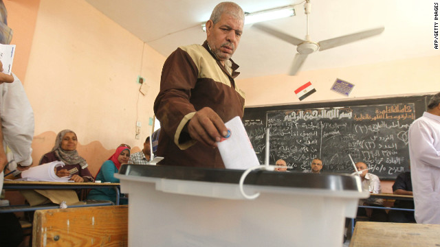 An Egyptian man drops off his ballot at a polling station Thursday in Cairo. The voting marks the first time Egypt has held a presidential election in which the results aren't known beforehand.