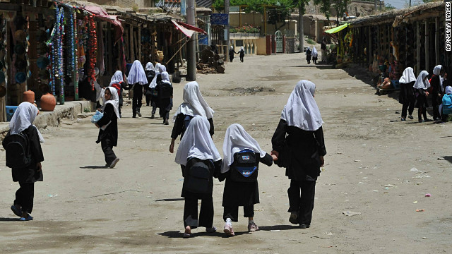 Afghan girls walk to school Tuesday in the village of Istalif, about 30 kilometers north of Kabul.
