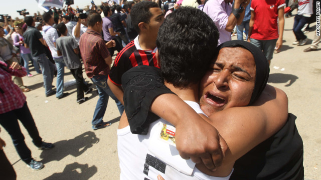 Families of the anti-regime protesters killed during last year's revolution celebrate after hearing Mubarak was given a life sentence for ordering troops to fire on protesters.