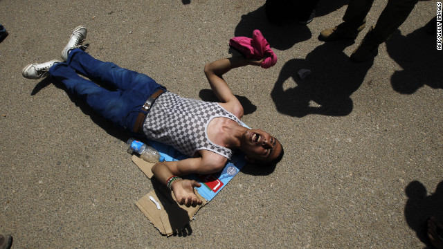 An anti-regime protester, who wanted the death penalty for Egypt's former leader, reacts to news of Mubarak's sentence.