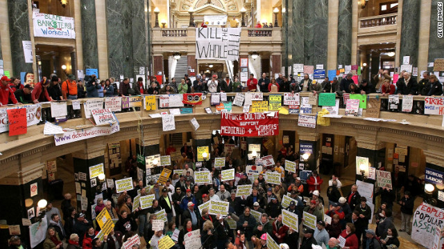 Union members and protesters fill the capitol rotunda in Madison.