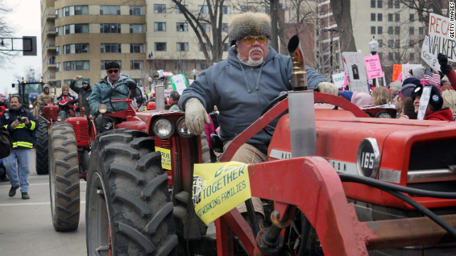 Farmers drive past the Wisconsin State Capitol during a rally March 12, 2011, in Madison.