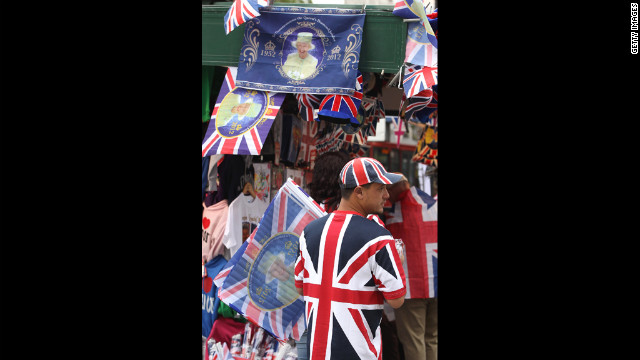 A vendor sells Union Jack and Diamond Jubilee memoribilia.